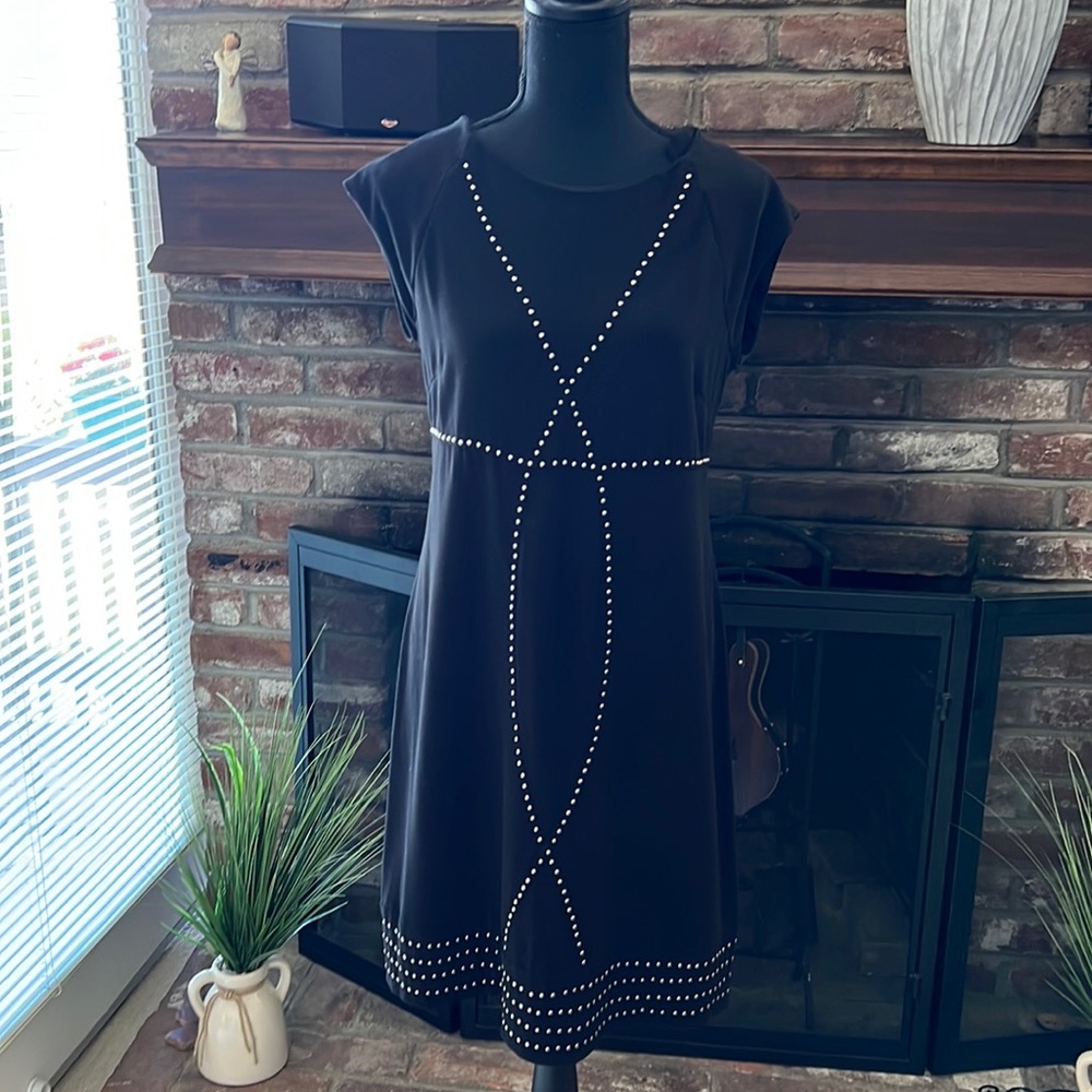 Little black dress with silver studs.